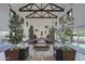 Community building lobby with plants and a rustic wooden table at 13143 N 145Th Ln, Surprise, AZ 85379