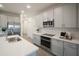 Modern kitchen with gray cabinets and white counters at 13143 N 145Th Ln, Surprise, AZ 85379