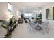 Open dining room with glass table and gray chairs at 13171 N 145Th Ln, Surprise, AZ 85379