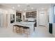 Modern kitchen with island, stainless steel appliances, and granite countertops at 13171 N 145Th Ln, Surprise, AZ 85379