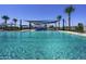 Community pool with water features and shade structures at 13171 N 145Th Ln, Surprise, AZ 85379