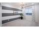 Stylish bedroom with gray and white accent wall and large window at 13183 N 145Th Ln, Surprise, AZ 85379