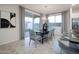 Dining area with gray chairs and black table next to sliding door at 13183 N 145Th Ln, Surprise, AZ 85379