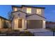 Two-story house with brown garage door and landscaping at 13183 N 145Th Ln, Surprise, AZ 85379