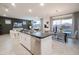 Modern kitchen with white cabinets and large island at 13183 N 145Th Ln, Surprise, AZ 85379