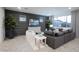 Living room with gray sectional sofa and a large TV at 13183 N 145Th Ln, Surprise, AZ 85379