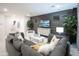 Living room with gray sectional sofa and statement wall at 13183 N 145Th Ln, Surprise, AZ 85379