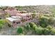 Aerial view of a community of two-story homes nestled in a desert landscape at 13227 N Mimosa Dr # 117, Fountain Hills, AZ 85268