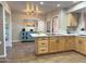 Bright kitchen featuring wood cabinets, an island, and a breakfast bar at 13227 N Mimosa Dr # 117, Fountain Hills, AZ 85268