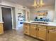 Modern kitchen with wood cabinets, island, and stainless steel appliances at 13227 N Mimosa Dr # 117, Fountain Hills, AZ 85268