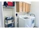 Laundry room with washer, dryer, and overhead cabinets at 13227 N Mimosa Dr # 117, Fountain Hills, AZ 85268