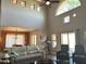 High-ceiling living room, lots of natural light, view into dining area at 13227 N Mimosa Dr # 117, Fountain Hills, AZ 85268