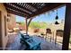 Relaxing patio with seating area, fire pit, and pergola at 13227 N Mimosa Dr # 117, Fountain Hills, AZ 85268