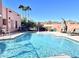 Inviting community pool with lounge chairs and mountain views at 13227 N Mimosa Dr # 117, Fountain Hills, AZ 85268