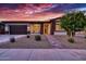 Single-story home with a two-car garage and walkway leading to the entrance at 14114 W Smoketree Dr, Surprise, AZ 85387