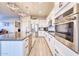 Modern kitchen with stainless steel appliances and white cabinetry at 14114 W Smoketree Dr, Surprise, AZ 85387