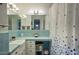 Clean bathroom with light teal tile and updated vanity at 148 E Coronado Rd # 45, Phoenix, AZ 85004