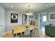 Bright dining room featuring a light wood table and six chairs at 148 E Coronado Rd # 45, Phoenix, AZ 85004