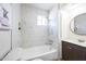 Bathroom with shower/tub combo and dark vanity at 1531 W Colter St # 7, Phoenix, AZ 85015