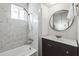 Updated bathroom with marble shower, vanity, and large mirror at 1531 W Colter St # 7, Phoenix, AZ 85015