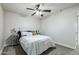 Bedroom with ceiling fan, neutral decor, and ample space at 1531 W Colter St # 7, Phoenix, AZ 85015