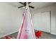 bedroom with teepee, toys, and ample closet space at 1531 W Colter St # 7, Phoenix, AZ 85015