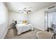 Spacious bedroom with a queen-size bed and ceiling fan at 1531 W Colter St # 7, Phoenix, AZ 85015