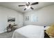 Bright bedroom with ceiling fan, window coverings and neutral decor at 1531 W Colter St # 7, Phoenix, AZ 85015