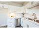 White kitchen with stainless steel dishwasher and corner sink at 1531 W Colter St # 7, Phoenix, AZ 85015