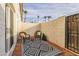 Private patio with wicker chairs and patterned rug at 1531 W Colter St # 7, Phoenix, AZ 85015