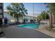 Community pool with lounge chairs and trees at 1531 W Colter St # 7, Phoenix, AZ 85015