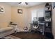 Home office with a desk, chair, and comfortable sofa at 15402 N 20Th St, Phoenix, AZ 85022