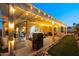 Lighted patio with pergola, grill, and seating area; great for outdoor entertaining at 15402 N 20Th St, Phoenix, AZ 85022