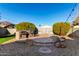 Landscaped backyard with built-in BBQ and patio at 1710 E Palo Verde St, Gilbert, AZ 85296