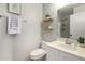 Modern bathroom with floating shelves and shower at 1710 E Palo Verde St, Gilbert, AZ 85296