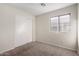 Simple bedroom with double door closet and window at 1710 E Palo Verde St, Gilbert, AZ 85296