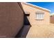 Side entrance to the home with a walkway and stone landscaping at 1710 E Palo Verde St, Gilbert, AZ 85296