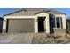 New single-story home with attached two-car garage and desert landscaping at 18070 W Cielo Grande Ave, Surprise, AZ 85387