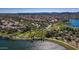 Aerial view of community with lake, walking paths, and homes at 18109 W Juniper Dr, Goodyear, AZ 85338