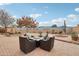 Relaxing patio with fire pit and seating area, perfect for outdoor entertaining at 18109 W Juniper Dr, Goodyear, AZ 85338