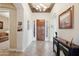 Bright and spacious entryway with tile flooring and chandelier at 18109 W Juniper Dr, Goodyear, AZ 85338