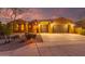 Stunning desert home with three-car garage and manicured landscaping at 18109 W Juniper Dr, Goodyear, AZ 85338