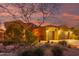 Beautiful home exterior at sunset with a two-car garage at 18109 W Juniper Dr, Goodyear, AZ 85338