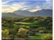 Scenic golf course view with mountain backdrop at 18109 W Juniper Dr, Goodyear, AZ 85338