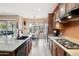 Well-lit kitchen with breakfast nook and large island at 18109 W Juniper Dr, Goodyear, AZ 85338