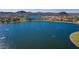 Aerial view of a community lake and surrounding landscape at 18109 W Juniper Dr, Goodyear, AZ 85338