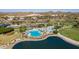 Resort-style pool area with multiple pools and a lake at 18109 W Juniper Dr, Goodyear, AZ 85338