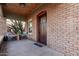 Inviting front porch with brick accents and a charming Arizona flag doormat at 1815 N Dayton St, Phoenix, AZ 85006