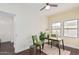 Home office with wood desk, green chairs, and natural light at 1815 N Dayton St, Phoenix, AZ 85006