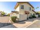 Cute two-story stucco home with a landscaped yard and walkway at 1817 E Hayward Ave # 3, Phoenix, AZ 85020